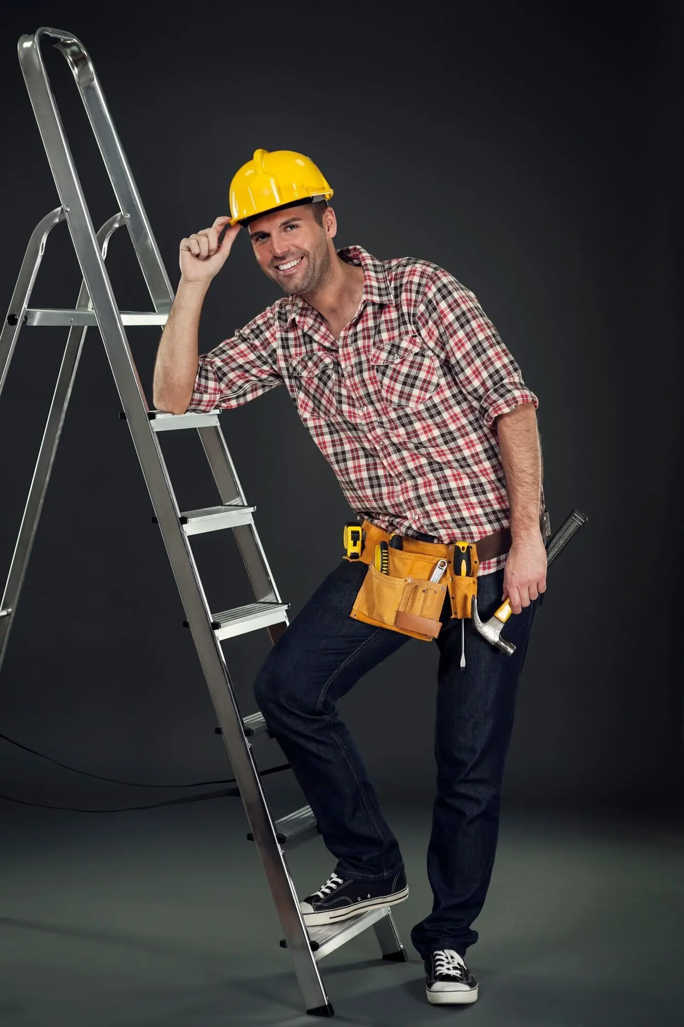 A manual laborer leaning against the ladder